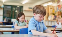 Schoolboy counting writing in classroom lesson at primary school<br>GettyImages-926840230