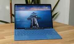 Microsoft Surface Pro 11 review desktop shown on a wooden table.