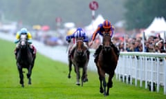 Paddington and jockey Ryan Moore (right) on their way to winning the Qatar Sussex Stakes.