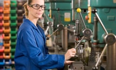 Machinist working on machine