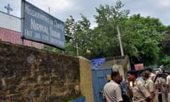 Police stand outside a home run by the Missionaries of Charity, in Ranchi, India.