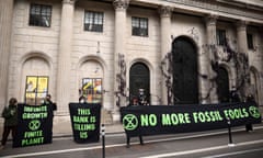 Activists from the Extinction Rebellion protesting outside the Bank of England, in London, today