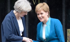 Theresa May is greeted by Nicola Sturgeon ahead of talks in Edinburgh in July 2016.