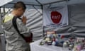 A man prays for the late Marussia Formula One driver Bianchi of France.