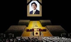 A portrait of former Japanese Prime Minister Shinzo Abe hangs on the stage during his state funeral on 27 September in Tokyo.