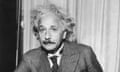 Albert Einstein<br>Portrait of physicist Albert Einstein, sitting at a table holding a pipe, circa 1933. (Photo by Lambert/Keystone/Getty Images)