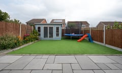 A back garden with artificial grass