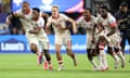 Canada's players celebrate their penalty shootout victory over Venezuela in the Copa América quarter-finals