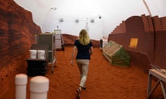 Dr Suzanne Bell walks through a simulated Mars exterior portion Mars Dune Alpha, a 3D printed habitat at the Johnson Space Center, in Houston, Texas.