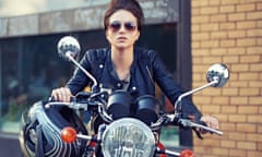 Motorcycle style Shot of a young and stylish female motorcycle rider outside