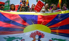 Members of the Tibetan Youth Congress carry the Tibetan flag at a protest in Delhi, India.