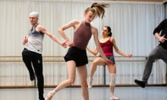 Birmingham Royal Ballet dancers play air guitar during rehearsals.