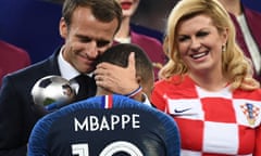 President Macron of France embraces Kylian Mbappé as he presents him with the Best Young Player Award after France’s win in the 2018 World Cup final.