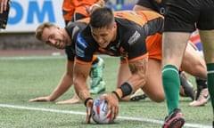 Mitch Clark of Castleford Tigers scores one of his side’s nine tries against Widnes