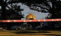 Police outside the Al Noor mosque in Christchurch in March 2019 after the mass shooting.Police on Thursday, March 4, 2021, arrested the 27-year-old man and charged him with threatening to kill. If found guilty, he faces a maximum prison sentence of seven years. (AP Photo/Vincent Yu, File)