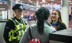 A British Transport Police officer and Metropolitan Police Constable talks to a woman arriving on the Eurostar from Brussels as officers from the Metropolitan Police Service, British Transport Police, Kent Police and UK Border Force take part in Operation Limelight at the Eurostar terminal at St Pancras International in London, which is aimed at safeguarding children and vulnerable people from harmful practices and human trafficking.