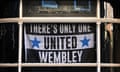 A flag is displayed in the window of the Newcastle Arms public house.