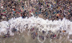 Discarded secondhand clothes cover a beach in Accra, Ghana