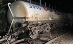 Freight train carrying cement after it came off the tracks over the River Petteril near Carlisle