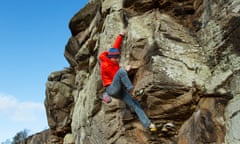 Climbing instructor Andy Swann bouldering at Colour Heugh, Back Bowden crag, near his home in Northumberland.