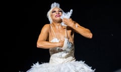 A muscular ballet dancer in a tutu dances the dying swan