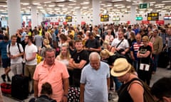 Thomas Cook passengers queue at Son Sant Joan airport in Palma de Mallorca