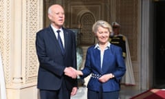 Saied shaking hands with von der Leyen outdoors for the cameras