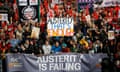 Large crowds at a march. Banners include 'austerity is failing', 'austerity that's enough' and 'no cuts'.