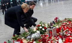 The German chancellor Angela Merkel and Canadian PM Justin Trudeau lay flowers in memory of victims of the Berlin truck attack.