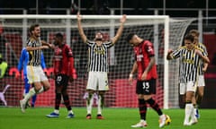 Juventus midfielder Manuel Locatelli (centre) celebrates by raising his arms in the air after the referee blew the final whistle.