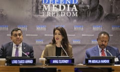 Amal Clooney, Tariq Ahmad and Abdalla Hamdok at a conference