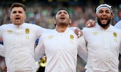Manu Tuilagi looks to the sky as he sings the national anthem with his England teammates prior to the Six Nations match against Ireland