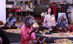 Avant garde singer Antony Hegarty (second on right) with artists in the Martu community in Parnngurr in Western Australia's Pilbara region in 2013. The Martu will have an exhibition at Sydney's Museum of Contemporary Art in July 2015 to voice their objections to a uranium mine proposed for their lands. Video still from Always Walking Country: Parrngurr Yarrkalpa.