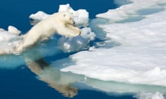 Jump sequence (3 of 3), Polar Bear (Ursus arctos), Hinlopen Strait, Svalbard, Norway, jumping onto an iceberg, Arctic Norway, Hinlopen Strait. For Review piece on books about global warming Ralph Lee Hopkins/National Geographic/Getty Creative