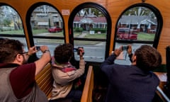 People on the Big D Fun Tours JFK Trolley take photos of the house on Beckley Avenue where Lee Harvey Oswald lived. 