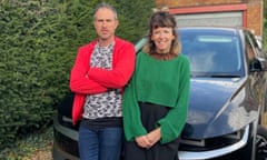 Oli Jones and Chloe Scott Moncrieff standing in front of their car