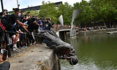 Protesters throw a statue of Edward Colston into Bristol harbour during a Black Lives Matter rally in June 2020.