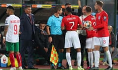 Jordan Henderson, right, and England teammates speak to members of Bulgaria’s staff, including the manager Krasimir Balakov, second left.