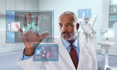 Black doctor looking at digital display in doctor's office