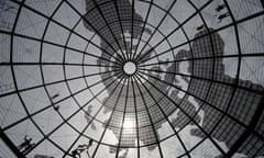 Workers are silhouetted as they replace broken LED lights on a huge bronze globe in front of a mall in Manila on April 22, 2012. At night, the structure will turn into an LED globe, a video display with resolution and full graphics made possible by the LED's 26,300 pieces of point lights. Activists across the globe are celebrating Earth Day on April 22 with events aimed at bringing awareness of environmental concerns. AFP PHOTO / NOEL CELIS (Photo credit should read NOEL CELIS/AFP/Getty Images)