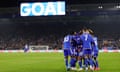 James Justin is swamped by his Leicester teammates after scoring against Sunderland