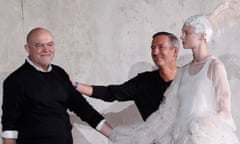 Christian Lacroix (l) with Dries Van Noten with female model dressed in white to their right