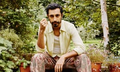 Riz Ahmed wears yellow shirt and cream loafer shoes with red buckle by Gucci; and floral trousers by Zn Ali.