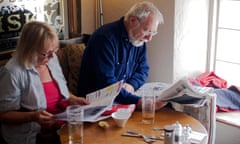 Retired couple reading the papers after Sunday lunch in The Bell Inn in the Somerset village of Buckland Dinhan. DAVID MANSELL<br>BWD1FY Retired couple reading the papers after Sunday lunch in The Bell Inn in the Somerset village of Buckland Dinhan. DAVID MANSELL