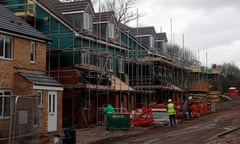 Builders construct homes on a Persimmon development in Coventry.