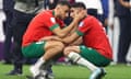 A dejected Romain Saïss and Achraf Hakimi after Morocco’s defeat.