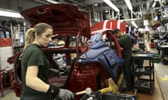 Workers on the assembly line at Jaguar Land Rover's plant in Castle Bromwich, England