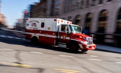 an ambulance drives through a city