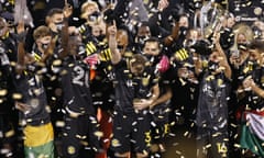 Columbus Crew players raise the trophy after defeating the Seattle Sounders 3-0 in the MLS Cup final