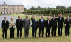 Italy’s Romano Prodi, Angela Merkel, Tony Blair, Jacques Chirac, Vladimir Putin, George W Bush, Japanese prime ninister Junichiro Koizumi, Canadian prime minister Stephen Harper, Finnish prime minister Matti Vanhanen and EU Commission Chief Jose Manuel Barroso posing for a family photo at the 2006 G8 meeting in St Petersburg.